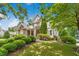 Two-story home boasting manicured landscaping and inviting entrance at 10909 Grand Journey Ave, Raleigh, NC 27614