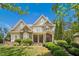 Charming two-story home featuring stone accents, manicured landscaping and inviting entrance at 10909 Grand Journey Ave, Raleigh, NC 27614