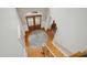 Grand foyer with a round rug, wooden floors, and a staircase leading to the upper level at 10909 Grand Journey Ave, Raleigh, NC 27614