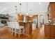 Spacious kitchen features wood cabinets, granite countertops, stainless steel appliances and a breakfast bar at 10909 Grand Journey Ave, Raleigh, NC 27614