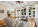 The living room features hardwood floors, a ceiling fan, and is open to the kitchen area at 10909 Grand Journey Ave, Raleigh, NC 27614