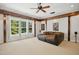 Spacious living room featuring a plush sofa, natural light, and recessed lighting at 10909 Grand Journey Ave, Raleigh, NC 27614