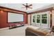 Spacious living room featuring home theater setup, including a large screen and projector at 10909 Grand Journey Ave, Raleigh, NC 27614