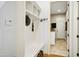Organized mudroom with built-in storage, a bench, and easy access to the laundry area at 10909 Grand Journey Ave, Raleigh, NC 27614