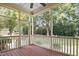 Screened porch with wood flooring, offering an outdoor living space with views of the backyard at 10909 Grand Journey Ave, Raleigh, NC 27614