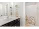 Bathroom with a vanity, framed mirror, and a shower with a floral shower curtain at 1138 Bexley Hills Bnd, Apex, NC 27502