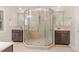 Bathroom featuring a glass enclosed shower stall, double sinks, and modern fixtures at 1138 Bexley Hills Bnd, Apex, NC 27502