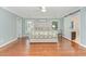Comfortable bedroom with hardwood floors, a ceiling fan, and natural light at 1138 Bexley Hills Bnd, Apex, NC 27502