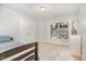 Neutral bedroom with a bed, large closet, plush carpet, and natural light at 1138 Bexley Hills Bnd, Apex, NC 27502