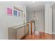 Inviting entryway with hardwood floors, modern cabinet, and personalized wall décor at 1138 Bexley Hills Bnd, Apex, NC 27502