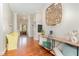 Spacious foyer with hardwood floors, decorative woodwork, and stylish furniture at 1138 Bexley Hills Bnd, Apex, NC 27502