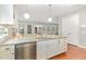 Kitchen with granite countertops, stainless steel appliances, and ample cabinet space at 1138 Bexley Hills Bnd, Apex, NC 27502