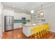 Kitchen with stainless steel appliances, granite countertops, and bright yellow seating at 1138 Bexley Hills Bnd, Apex, NC 27502