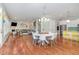 Open-concept living room and kitchen with hardwood floors and modern finishes at 1138 Bexley Hills Bnd, Apex, NC 27502