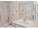 Well-lit bathroom featuring a bathtub with shower, vanity sink, and neutral finishes at 122 Barringer Dr, Garner, NC 27529
