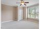 Bedroom features neutral walls, carpet, and a bright window view at 122 Barringer Dr, Garner, NC 27529