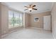 Spacious bedroom with neutral walls, large windows, and ceiling fan offering a serene living space at 122 Barringer Dr, Garner, NC 27529