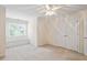 Cozy bedroom features neutral walls, a ceiling fan, and a charming window seat by the window at 122 Barringer Dr, Garner, NC 27529