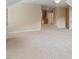 Expansive bonus room with neutral walls and carpet, providing ample space for various activities at 122 Barringer Dr, Garner, NC 27529