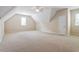 Spacious bonus room with neutral carpet and a ceiling fan, ideal for a game room or home theater at 122 Barringer Dr, Garner, NC 27529