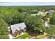 Charming brick home with manicured lawn and mature trees in a desirable neighborhood at 122 Barringer Dr, Garner, NC 27529