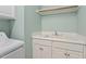 Functional laundry room featuring a utility sink, cabinetry, and a washing machine hook-up at 122 Barringer Dr, Garner, NC 27529