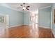 Open living room featuring hardwood floors and archway to the entry at 122 Barringer Dr, Garner, NC 27529