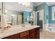 Elegant primary bathroom with dual vanity, soaking tub, and separate shower for a luxurious retreat at 122 Barringer Dr, Garner, NC 27529