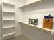 Bright walk-in closet featuring shelving and hanging racks for excellent storage at 122 Barringer Dr, Garner, NC 27529