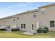 Townhome backyard with vinyl siding, manicured lawn, and concrete patio at 129 Explorer Dr # 256, Morrisville, NC 27560