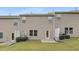Townhome backyard with vinyl siding, manicured lawn, and concrete patio at 129 Explorer Dr # 256, Morrisville, NC 27560
