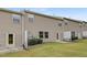 Townhome backyard with vinyl siding, manicured lawn, and concrete patio at 129 Explorer Dr # 256, Morrisville, NC 27560