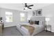Bright bedroom featuring neutral tones, soft carpet, and a ceiling fan at 129 Explorer Dr # 256, Morrisville, NC 27560