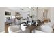Bright dining area open to living space with elegant decor, wood floors, and ample seating at 129 Explorer Dr # 256, Morrisville, NC 27560