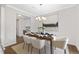 Elegant dining room with stylish chandelier, decorative table setting, and neutral accents at 129 Explorer Dr # 256, Morrisville, NC 27560