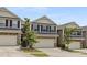 Inviting townhouse features a convenient two-car garage and well-kept front yard at 129 Explorer Dr # 256, Morrisville, NC 27560