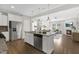 Open kitchen featuring an island with stainless steel appliances and granite countertops at 129 Explorer Dr # 256, Morrisville, NC 27560