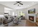 Cozy living room featuring a fireplace, modern decor, and plenty of natural light at 129 Explorer Dr # 256, Morrisville, NC 27560
