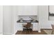 Cozy office nook showcasing custom cabinetry, a granite countertop, and a stylish chair on hardwood floors at 129 Explorer Dr # 256, Morrisville, NC 27560