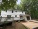 Beautiful home featuring a wooden deck, a backyard, and an attached garage at 1300 Seabrook Ave, Cary, NC 27511