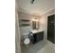 Updated bathroom with white marble-look floors, modern vanity and glass shower at 1300 Seabrook Ave, Cary, NC 27511