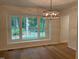 Dining room featuring hardwood floors, recessed lighting, and a modern chandelier at 1300 Seabrook Ave, Cary, NC 27511