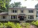 Charming two-story home featuring a welcoming entrance, neutral shutters, and mature landscaping at 1300 Seabrook Ave, Cary, NC 27511