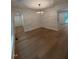Spacious living room with hardwood floors, modern lighting, and ample natural light at 1300 Seabrook Ave, Cary, NC 27511