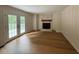 Inviting living room with a brick fireplace, wood-look floors and access to the deck at 1300 Seabrook Ave, Cary, NC 27511