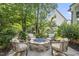 Inviting backyard features a stone fire pit and seating, perfect for outdoor relaxation and entertainment at 1325 Mackinaw Dr, Wake Forest, NC 27587