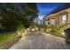 Backyard patio features a stone fire pit with comfortable seating, ideal for relaxing or entertaining guests at 1325 Mackinaw Dr, Wake Forest, NC 27587