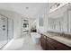 Beautiful bathroom with a walk-in shower, large mirrors, and an opening leading into a bedroom at 1325 Mackinaw Dr, Wake Forest, NC 27587