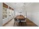 Dining room features a coffered ceiling, wood floors, large windows and ample seating at 1325 Mackinaw Dr, Wake Forest, NC 27587
