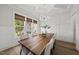 Elegant dining room with wood floors, coffered ceiling, and large windows for natural light at 1325 Mackinaw Dr, Wake Forest, NC 27587